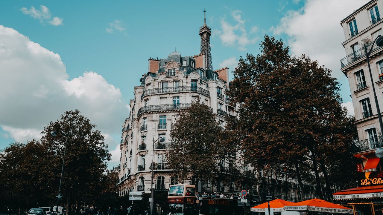 A Paris street corner with the Eiffel Tower behind