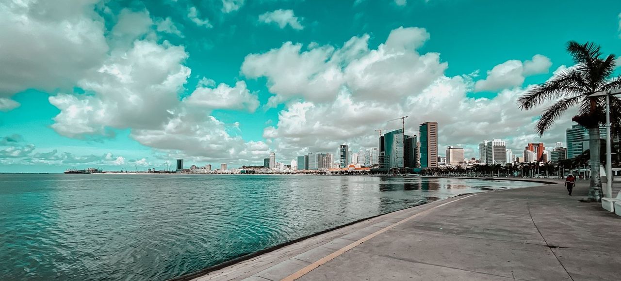 Beautiful bayfront view of Luanda, Angola with clouds and skyline reflection
