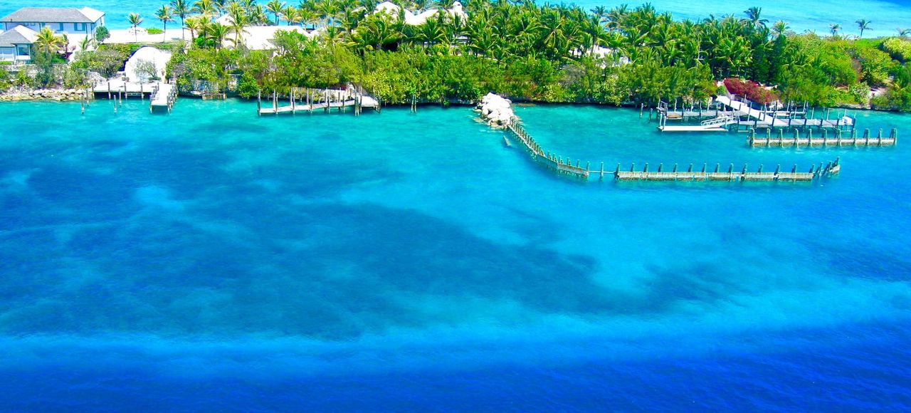 A breathtaking aerial view of Nassau, Bahamas showcasing vibrant blue waters and lush greenery