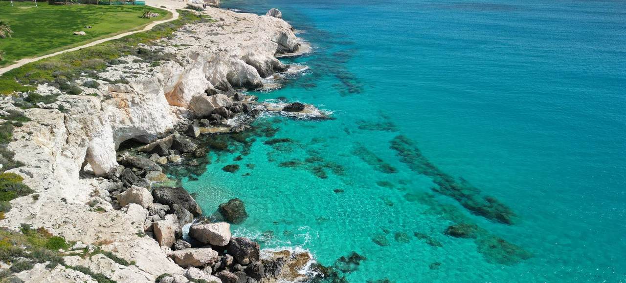 Stunning aerial photo of Ayia Napa's rocky coast with turquoise sea in Cyprus