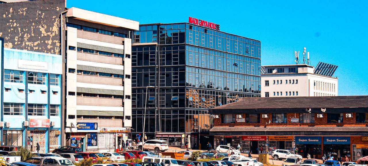 Eswatini: Vibrant cityscape of Matsapha, showcasing modern architecture and bustling streets under a clear blue sky