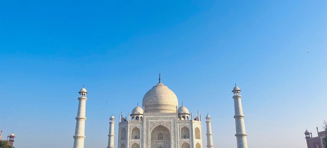 Stunning daytime view of the Taj Mahal with clear blue sky in Agra, India