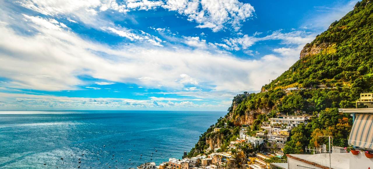 Italy: Breathtaking view of the Amalfi Coast with vibrant blue sea and lush green hillsides