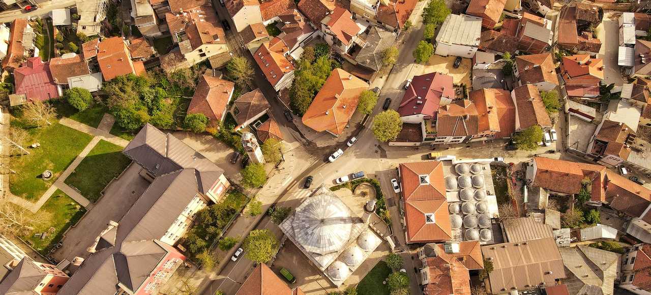 Kosovo: Drone shot of Prishtinë urban landscape with red roofs and unique architecture