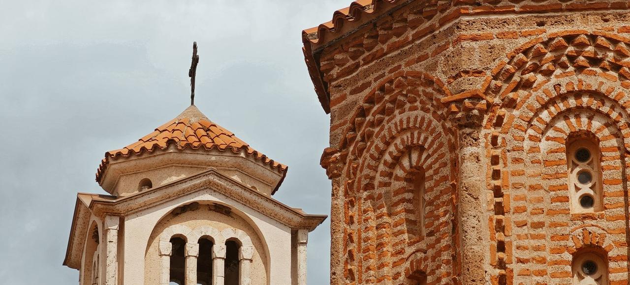 North Macedonia: Close-up of Byzantine-style church with orange brick and tile roof