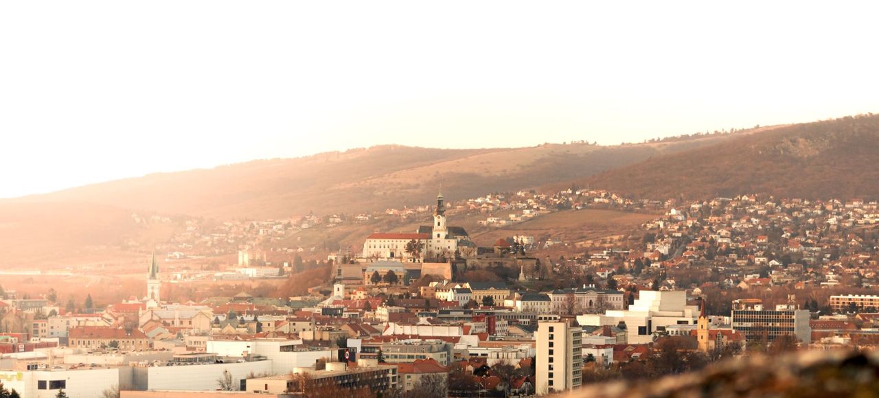 Slovakia: Stunning view of Nitra city and castle under a warm sunset glow