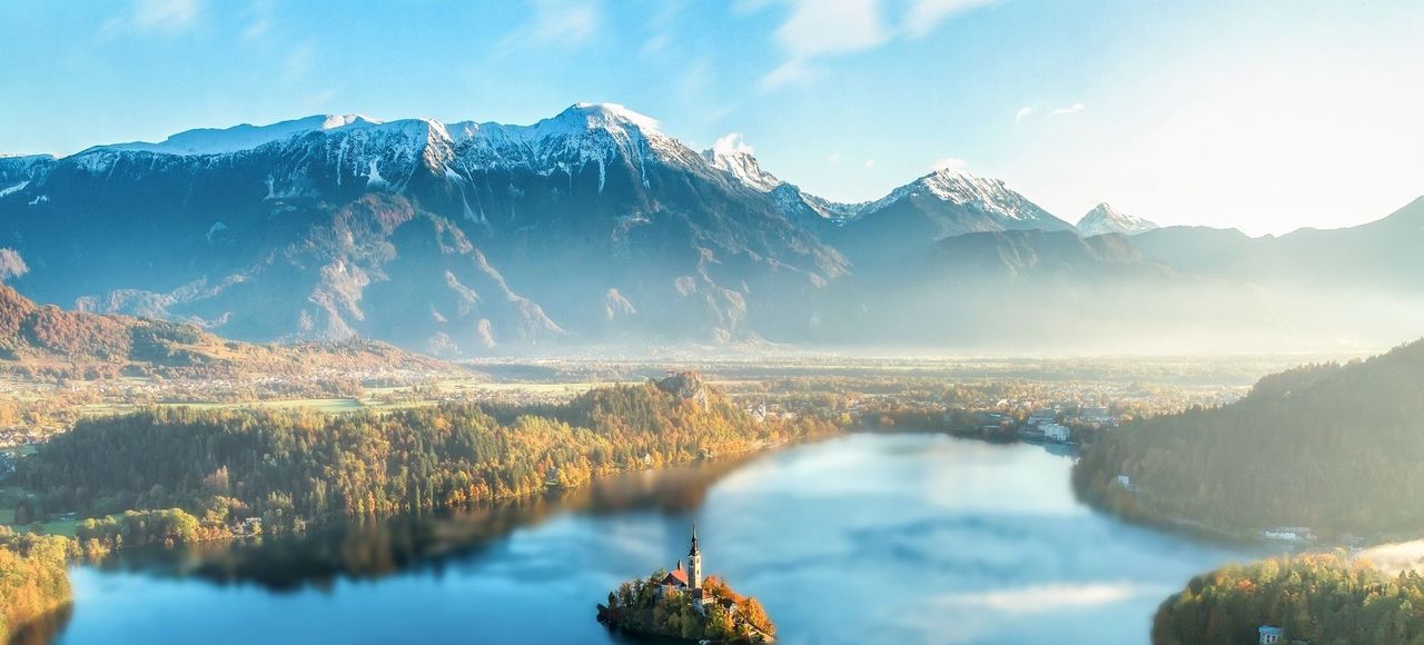 Slovenia: Majestic Lake Bled with church on island, surrounded by Julian Alps under sunset light
